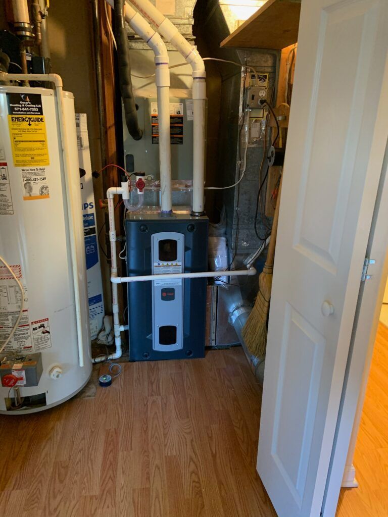 A room with a heater and a water heater in it