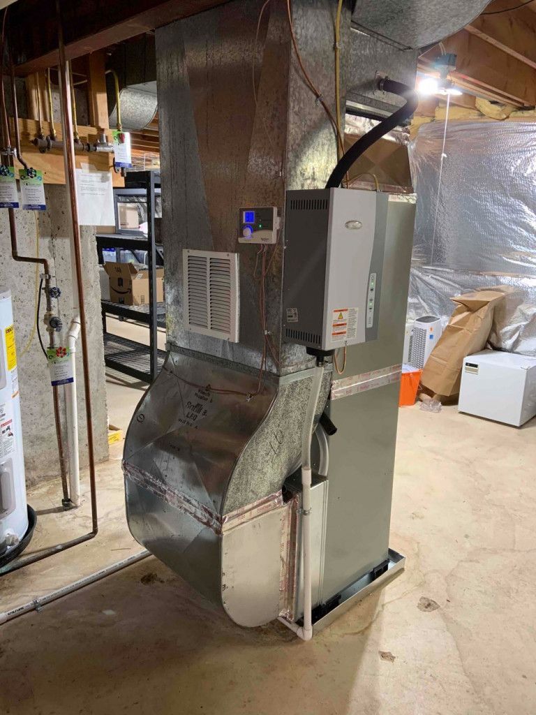 A heating and cooling system is installed in a basement