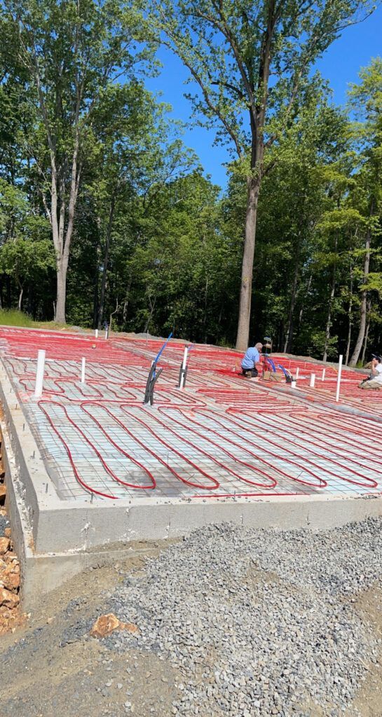 A man is working on a foundation of a house