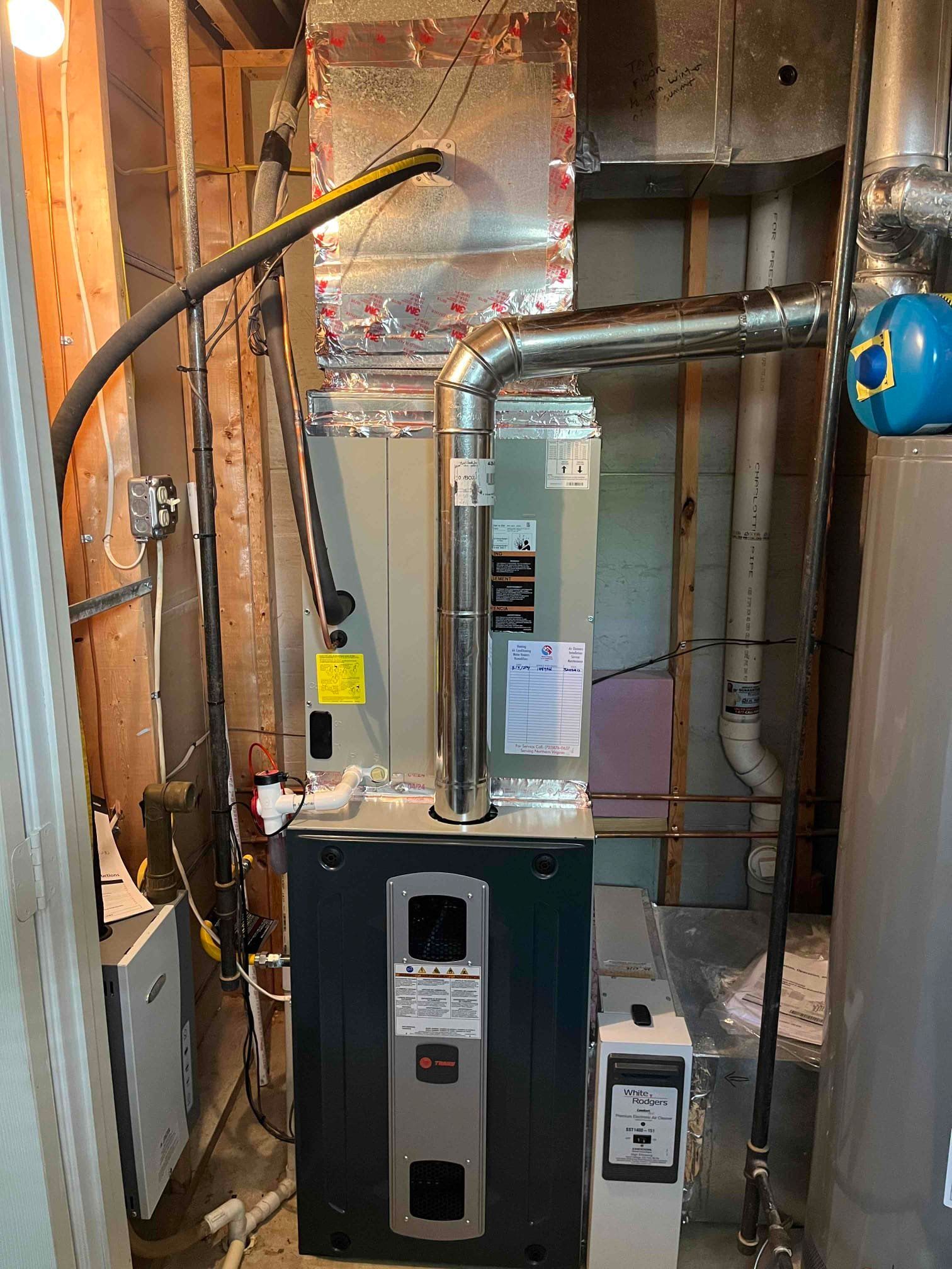 A basement with a water heater installed in it