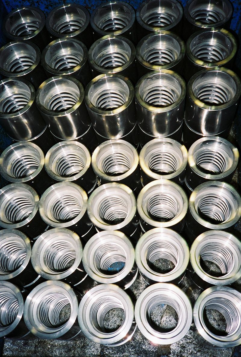 A bunch of metal cylinders are stacked on top of each other.