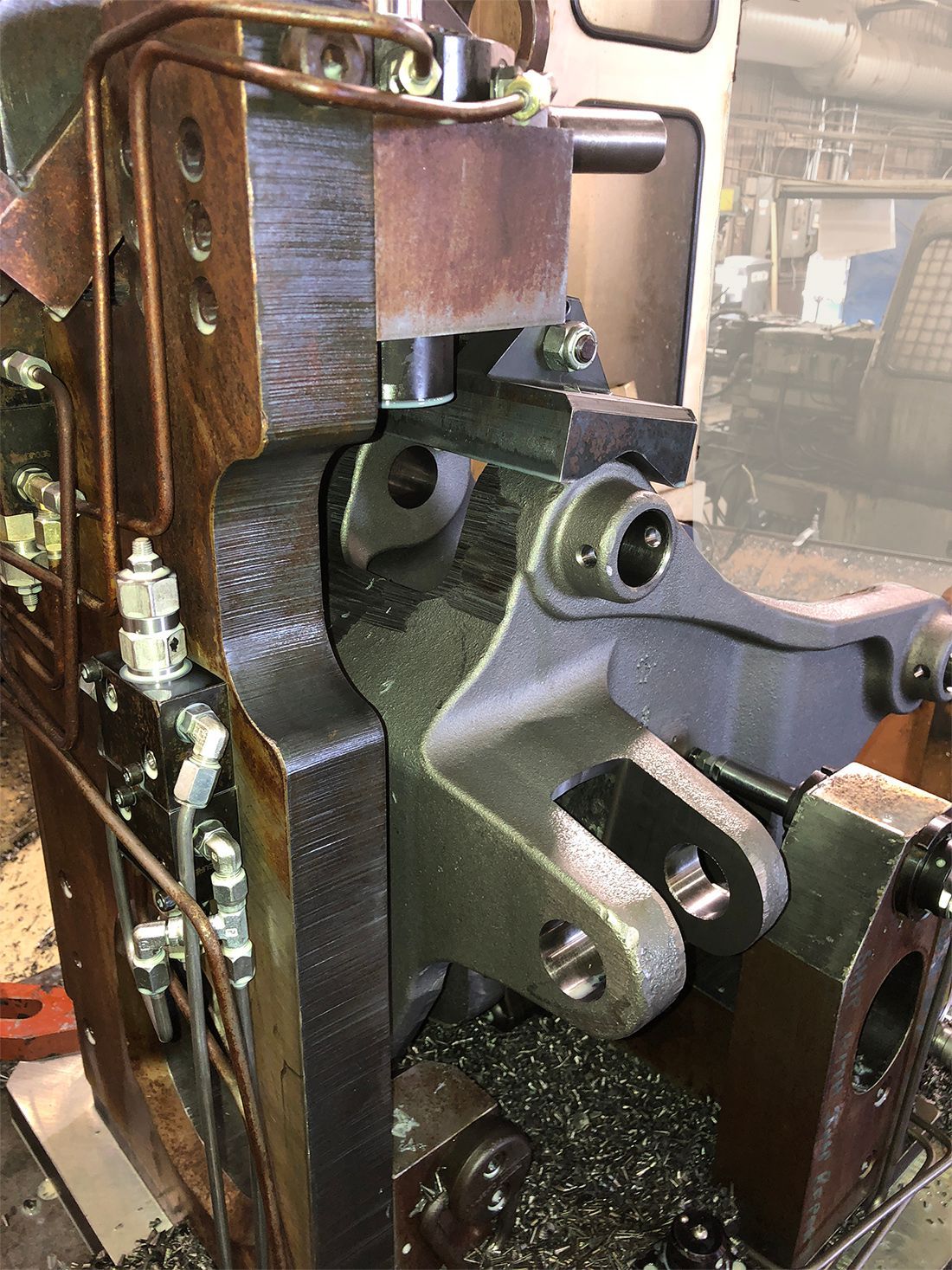 A close up of a machine that is being built in a factory.