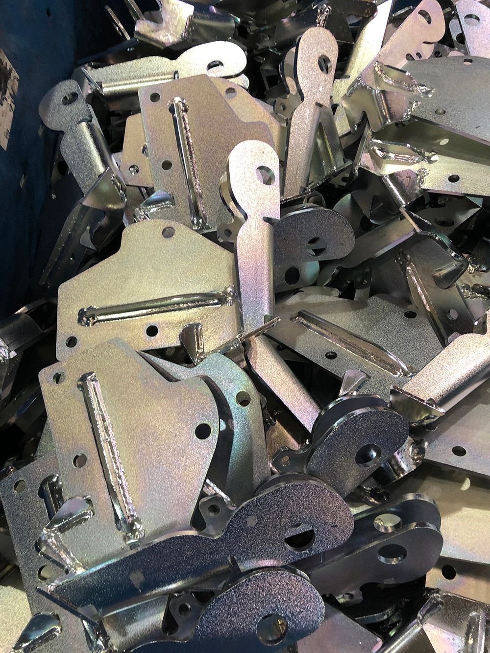 A pile of metal pieces sitting on top of each other on a table.