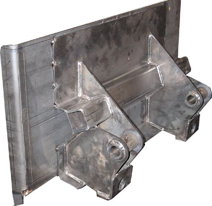 A piece of metal is sitting on a white surface.