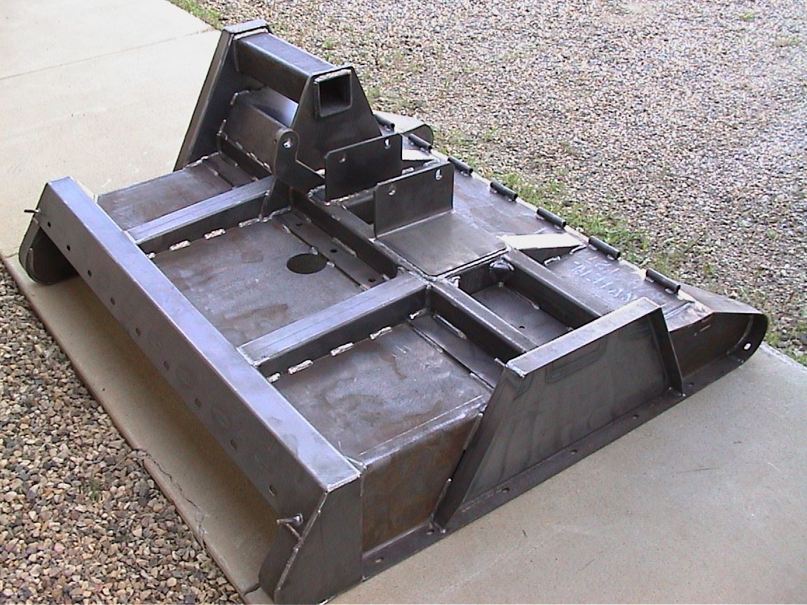 A piece of metal is sitting on a sidewalk