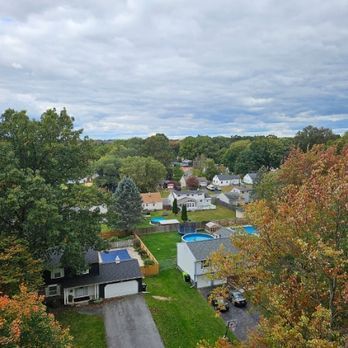 An aerial view of a residential area with houses and trees