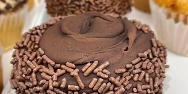 Chocolate cupcake with frosting and sprinkles.