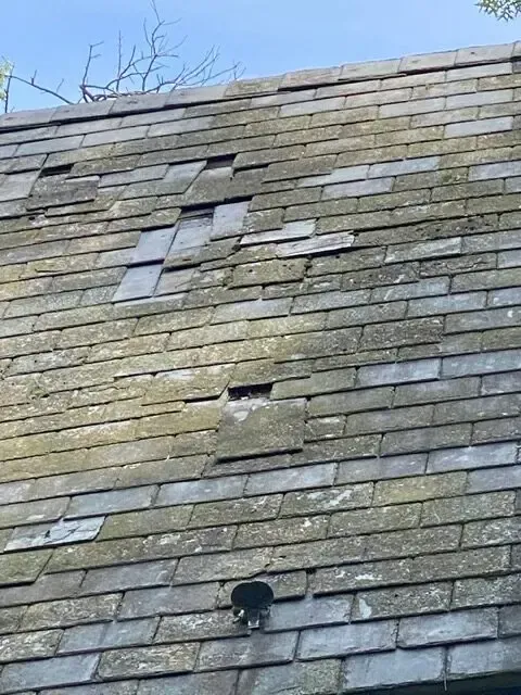 A close up of a roof with a hole in it.