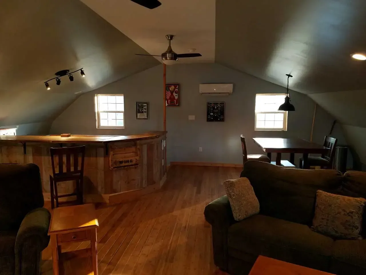 A living room with a couch a table and chairs