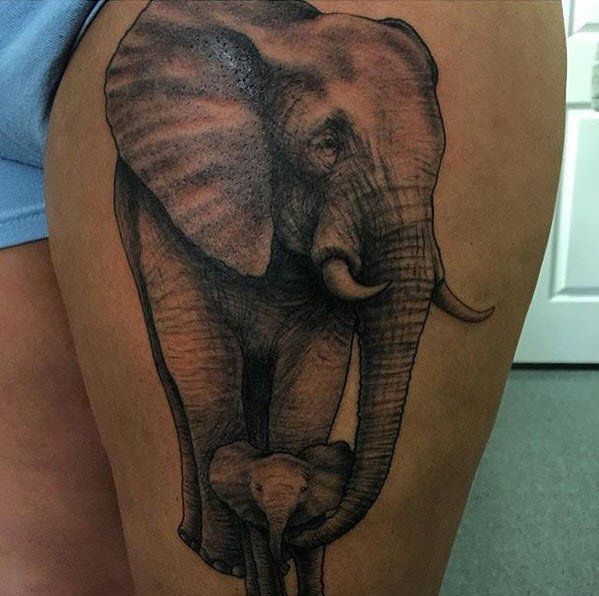 Tattoo of a large elephant and baby elephant on a thigh, detailed grayscale drawing.