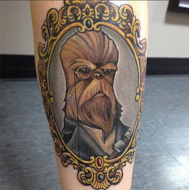 Tattoo of a Wookiee in a portrait frame, wearing a monocle and coat.