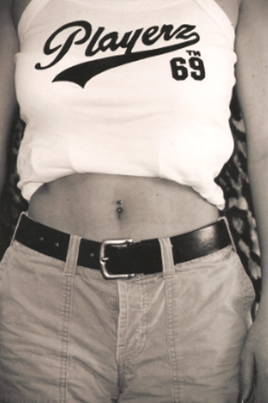 Person wearing a white tank top with