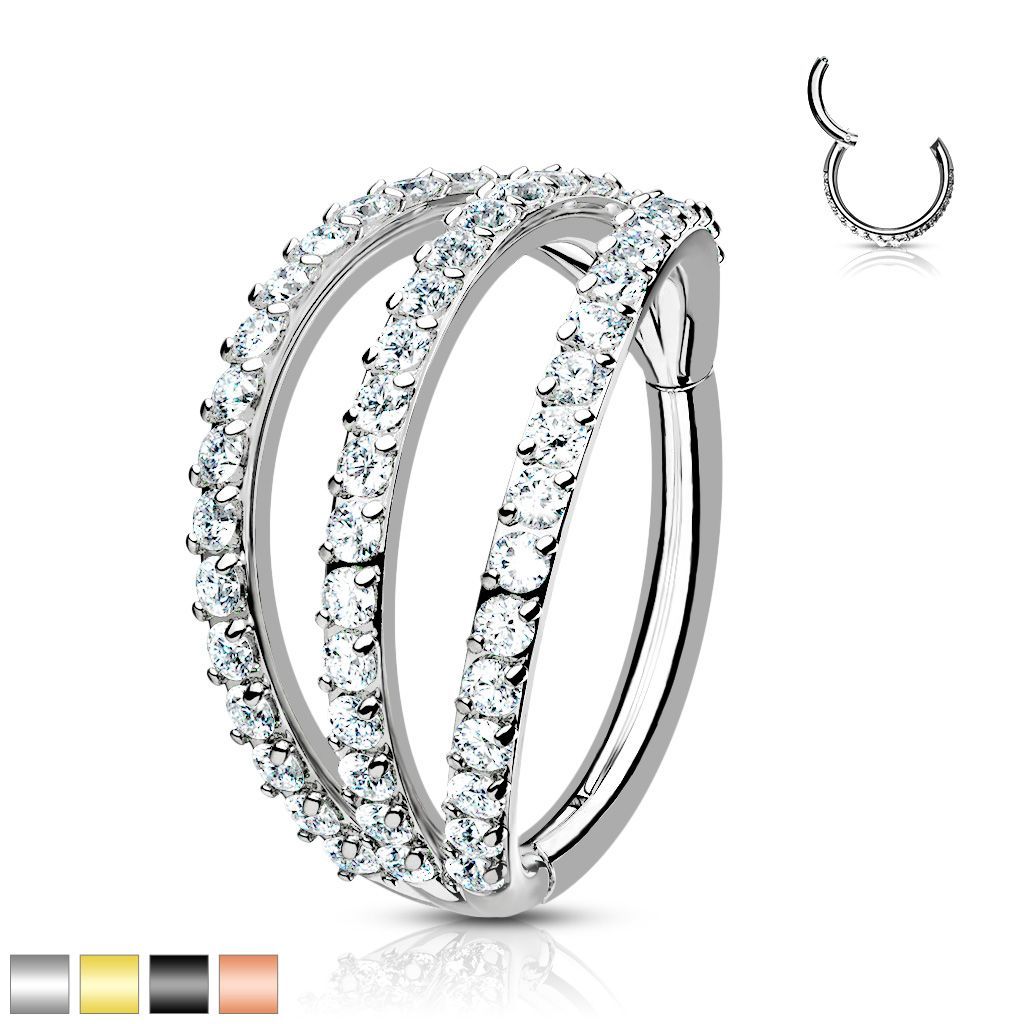 Silver septum ring with three stacked, jeweled hoops.