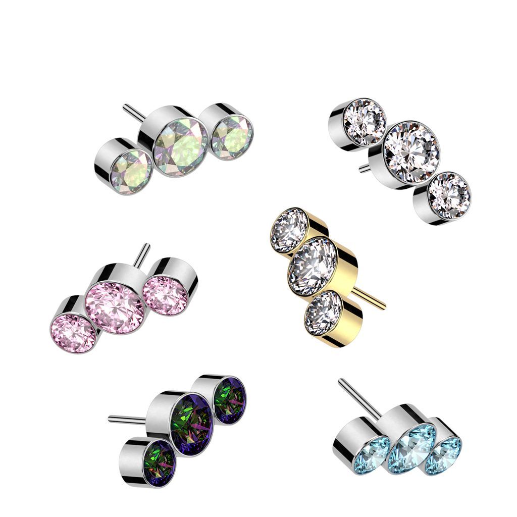Seven different styles of triple gem ear piercing jewelry.