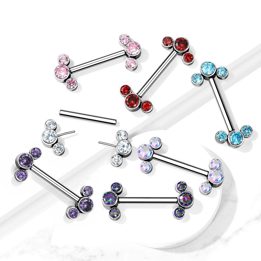 Jewelry: Various nipple piercings with colorful gem clusters.