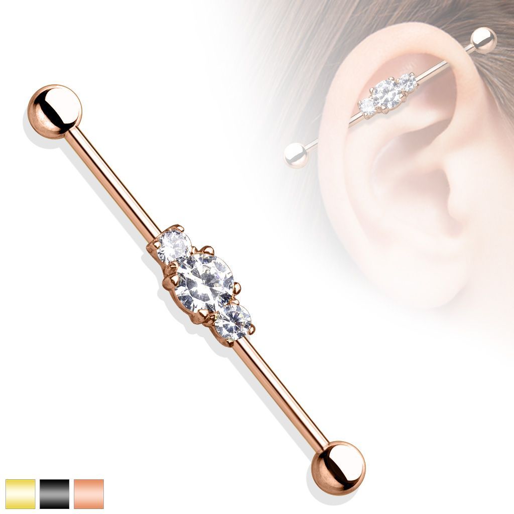 Rose gold industrial barbell earring with clear gems.