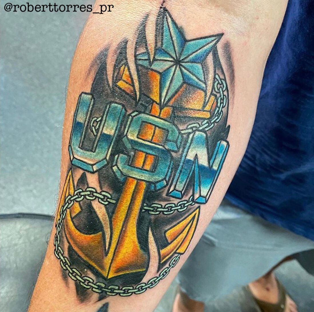 Tattoo of US Navy insignia: anchor, star,