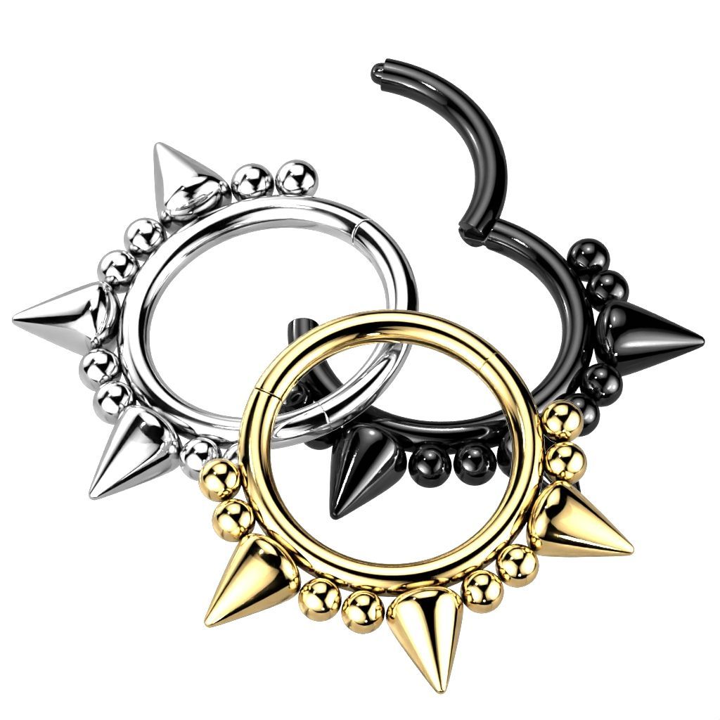 Three hinged septum rings: silver, black, and gold, each with spikes and small beads.