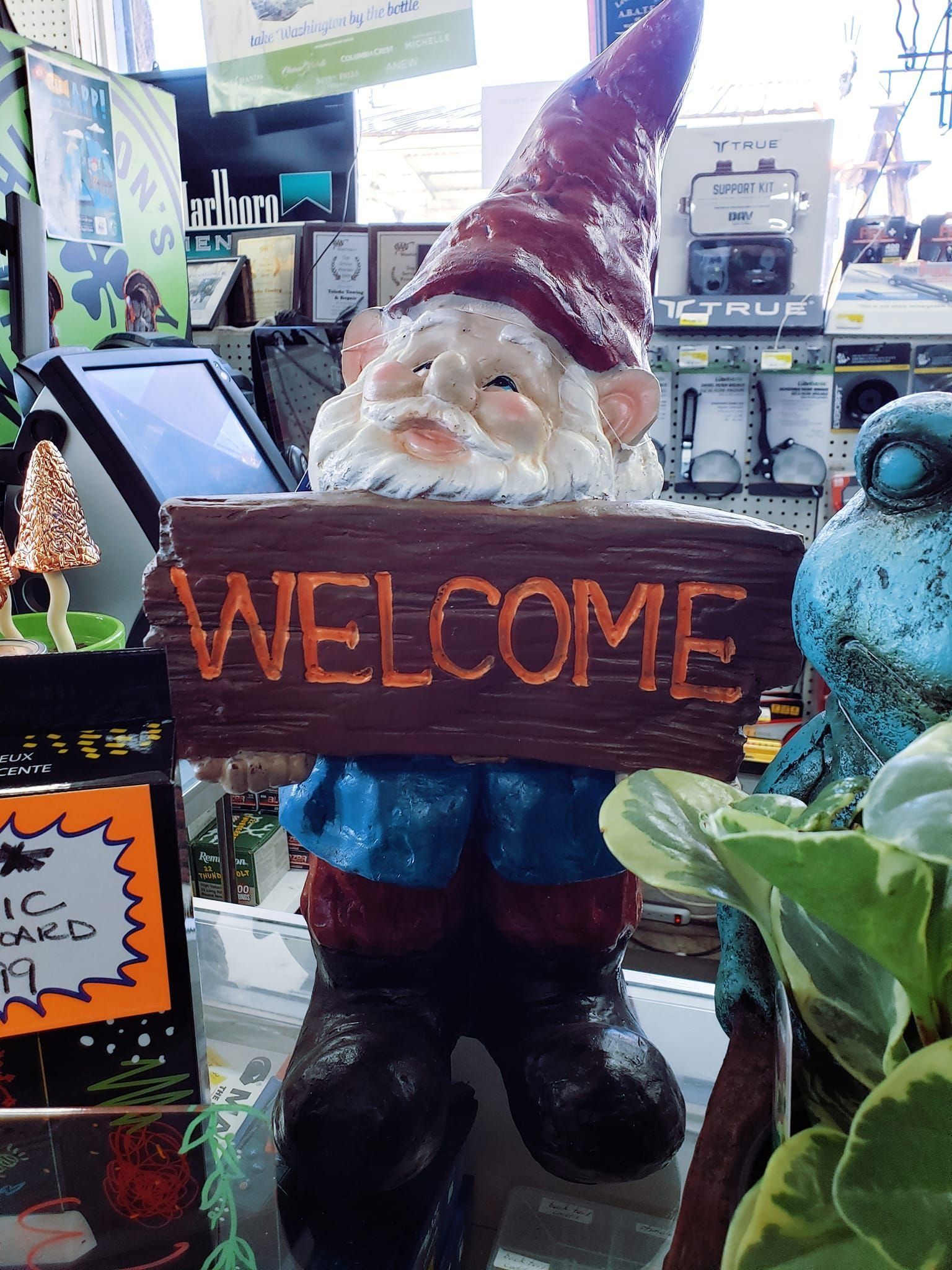 Garden gnome statue holding 