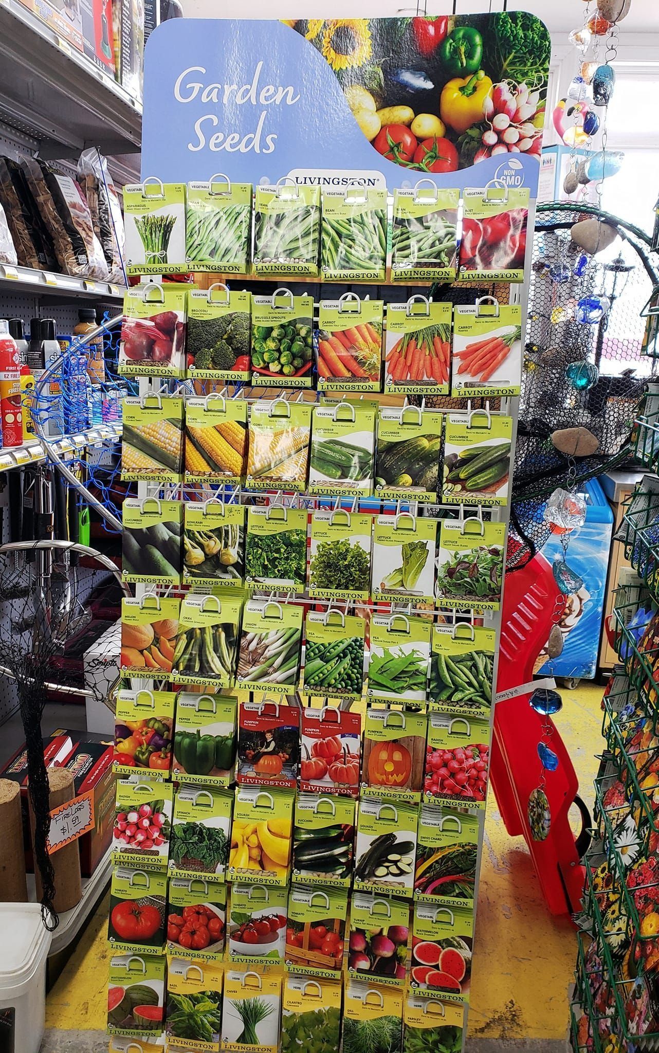 Seed packets displayed on a tall store stand, labeled 