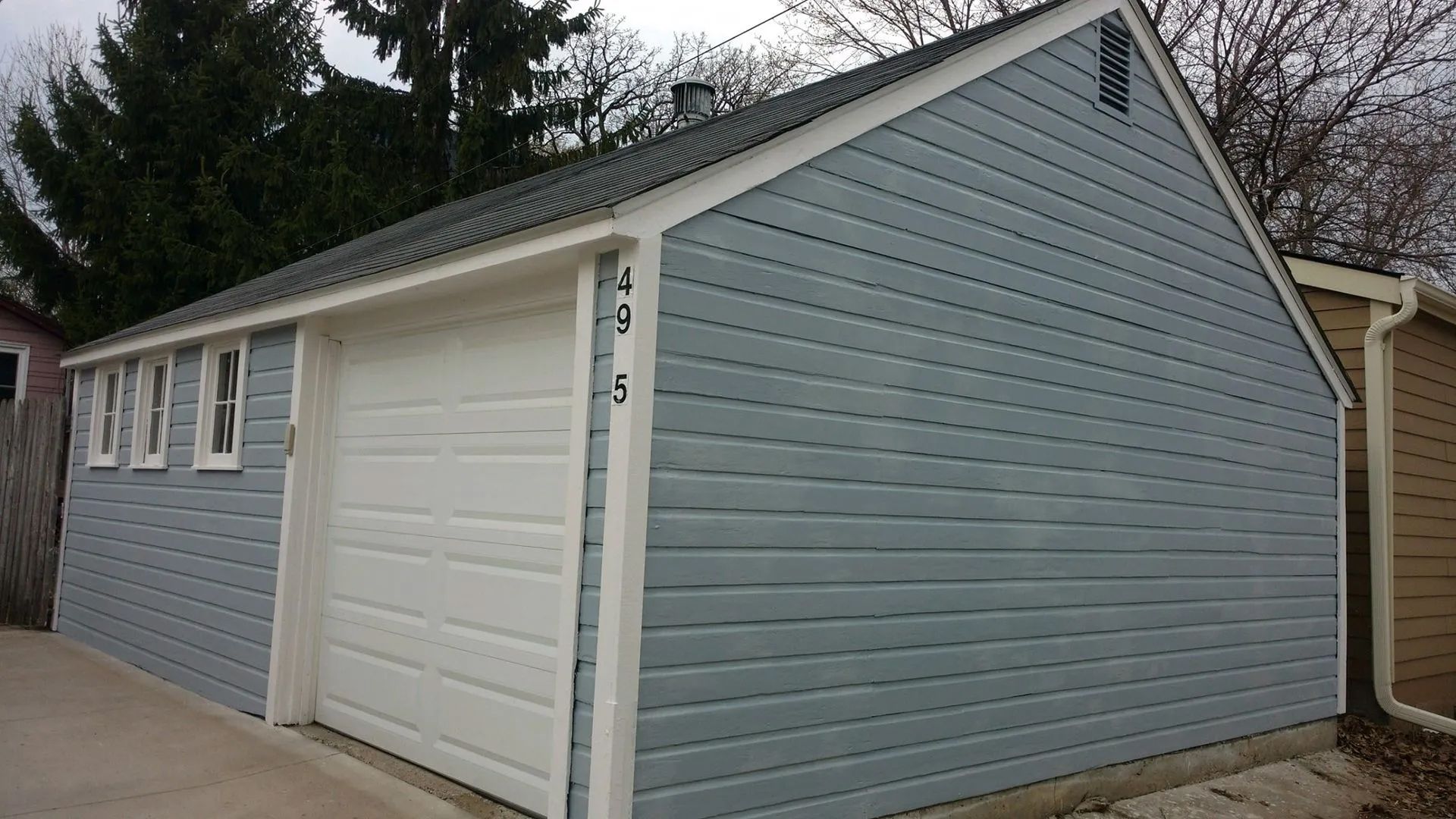 After: Damaged siding repaired and exterior painting completed on this home in Urbandale, Iowa by Harmony Painting. Proper preparation and repairs help ensure a clean, long-lasting finish.