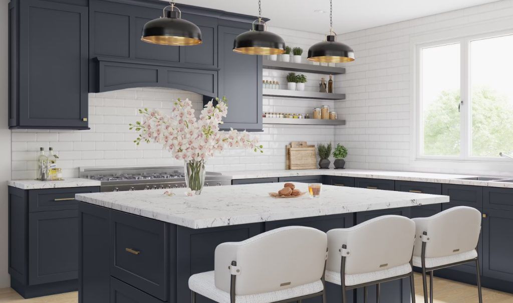 Navy blue kitchen with island, white countertops, three pendant lights, and white bar stools.