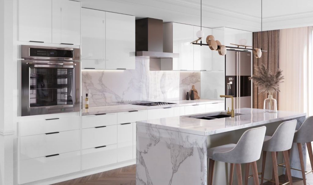 Modern white kitchen with marble countertops, stainless steel appliances, and a central island with bar stools.