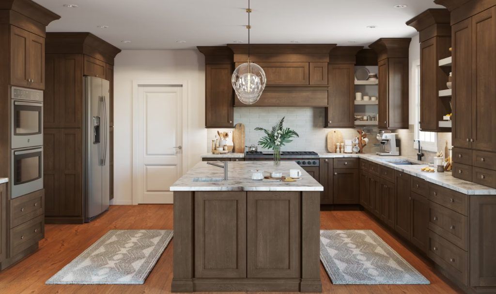 Brown kitchen with island, cabinets, and appliances. Light wood floors, white countertops, and a chandelier.