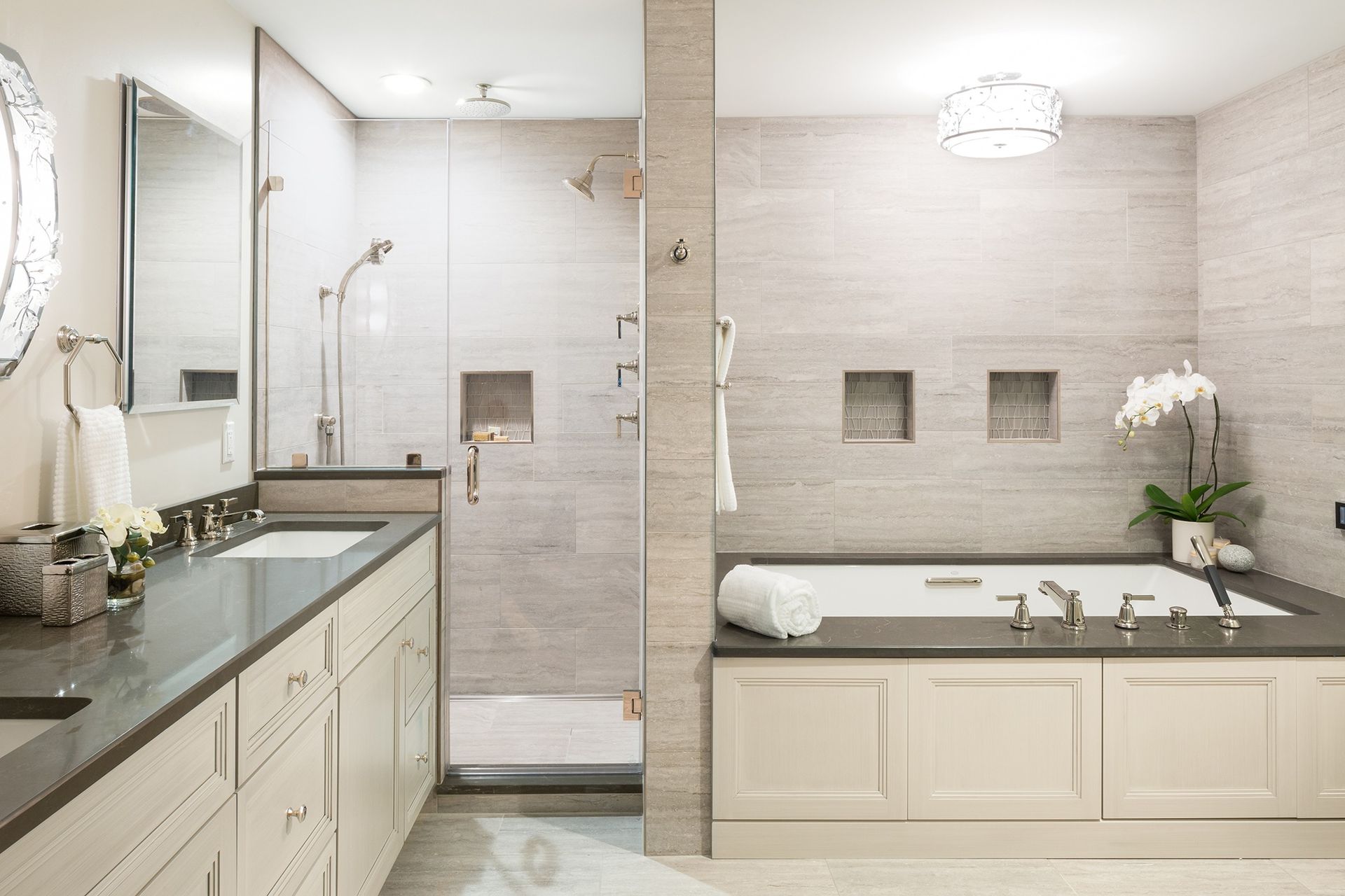 Bathroom with white wainscoting and toilet. Features a sink, mirror, purple towels and curtains, and a window.