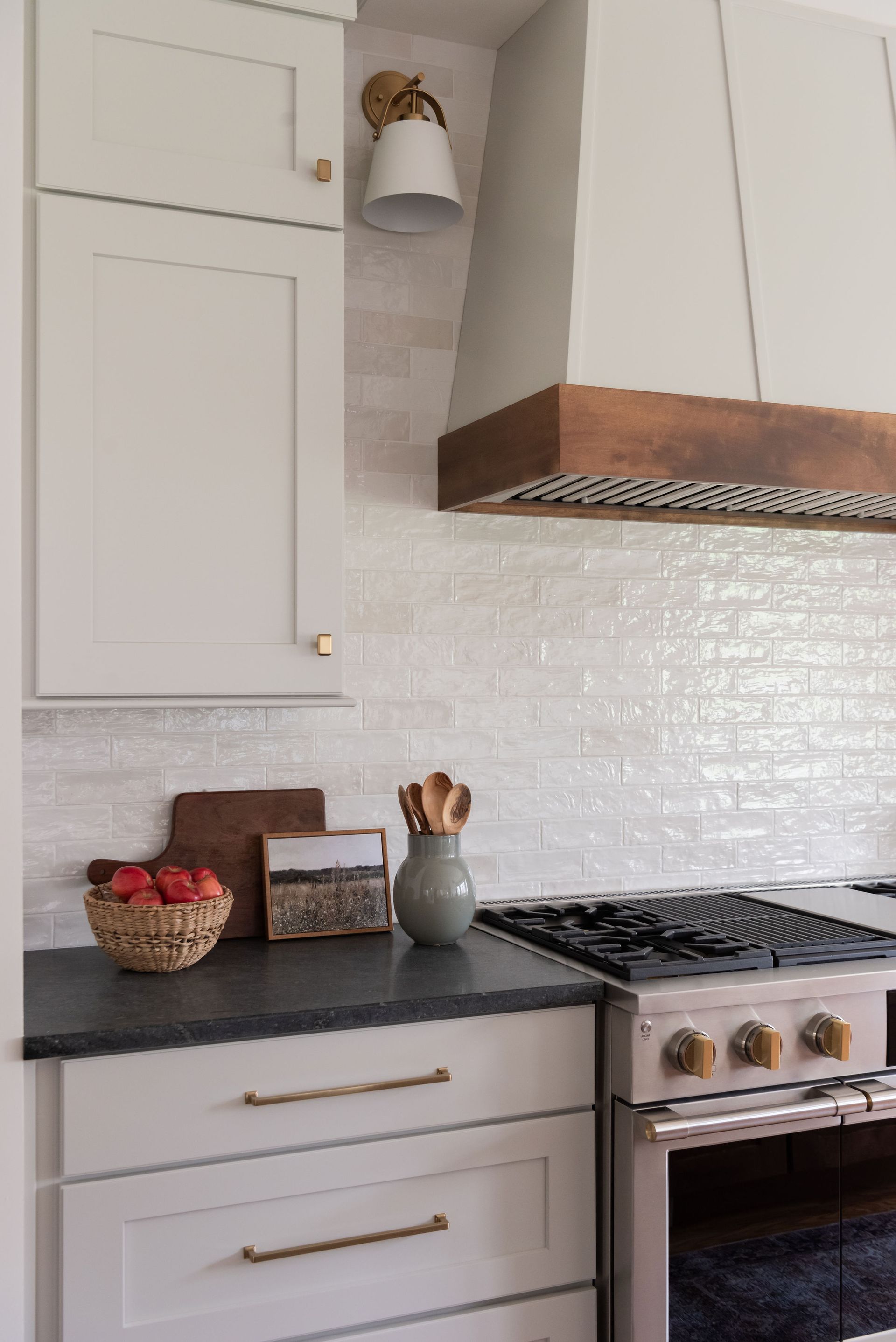 Kitchen with white cabinets, light gray countertops, and a white tile backsplash.