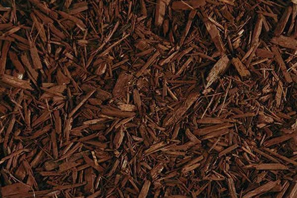 A close up of a pile of brown mulch.