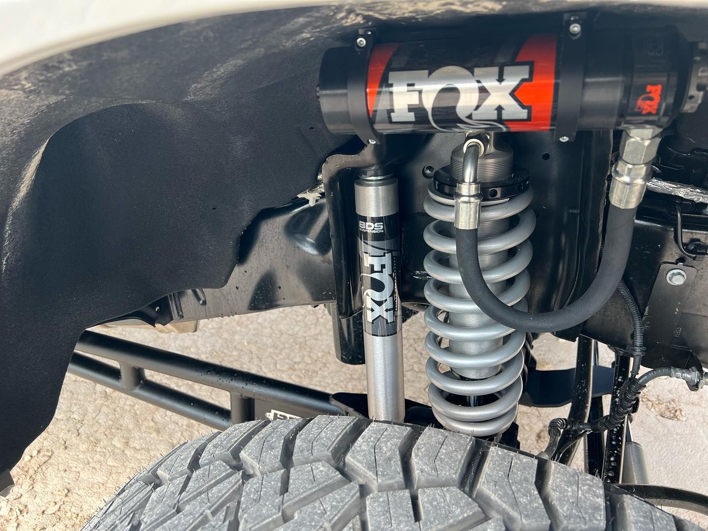 A close up of a fox shock on a truck