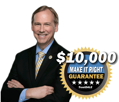 A man in a suit and tie is standing next to a $ 10,000 make it right guarantee sticker.