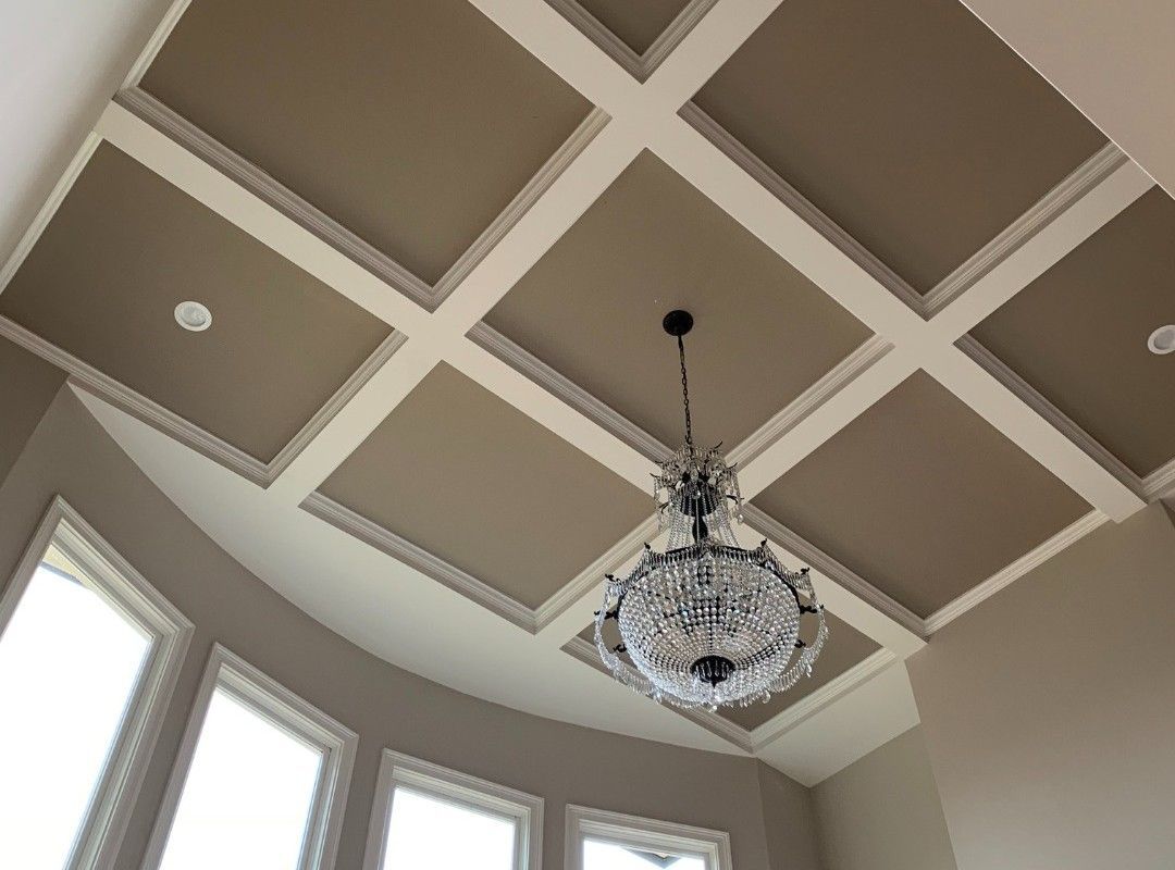 A chandelier is hanging from the ceiling of a room