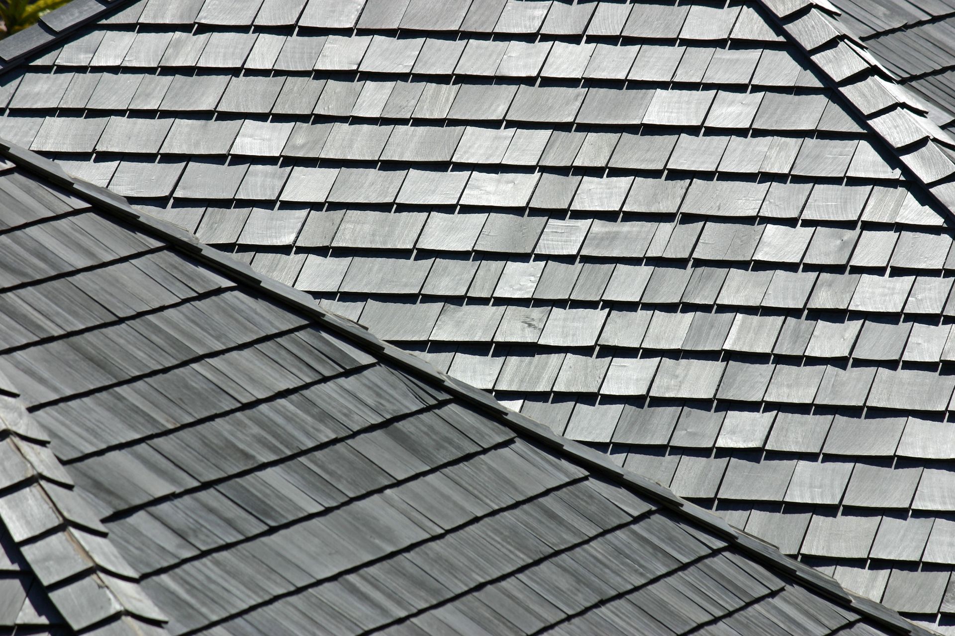 A close up of a roof made of wooden tiles
