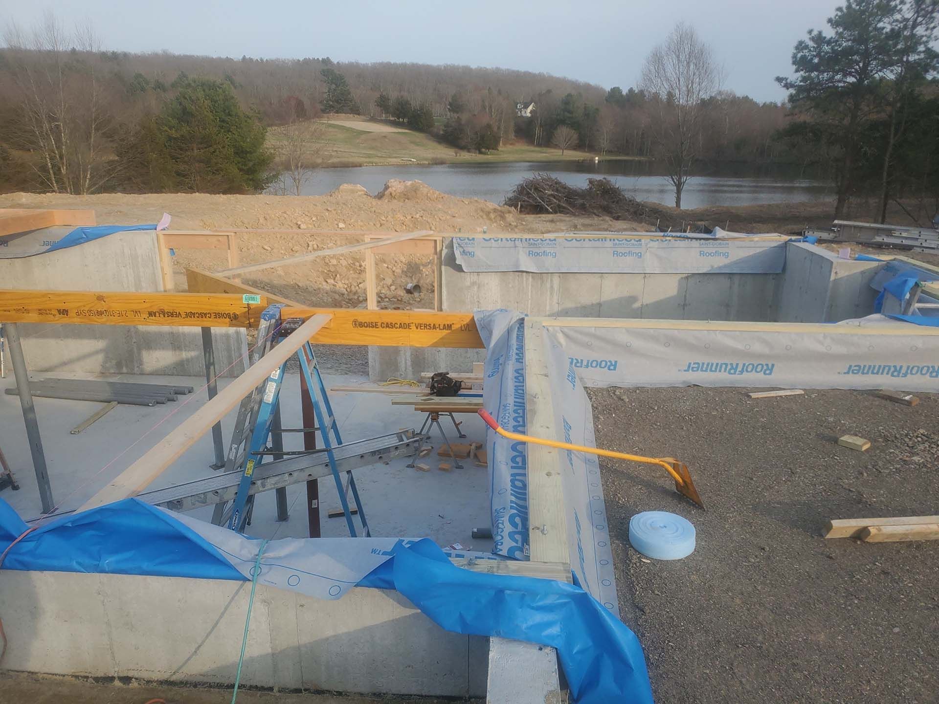 A construction site with a lake in the background