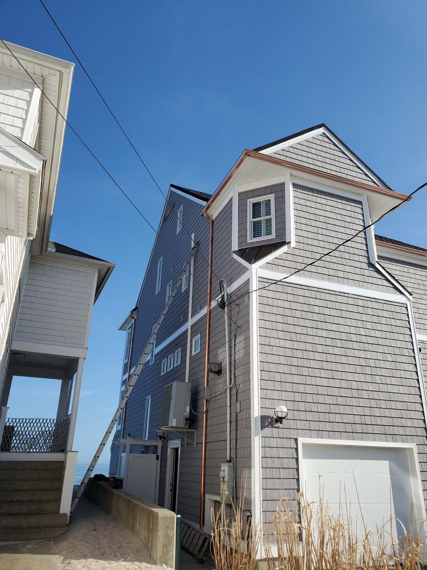 A large brick building with a staircase leading up to it.