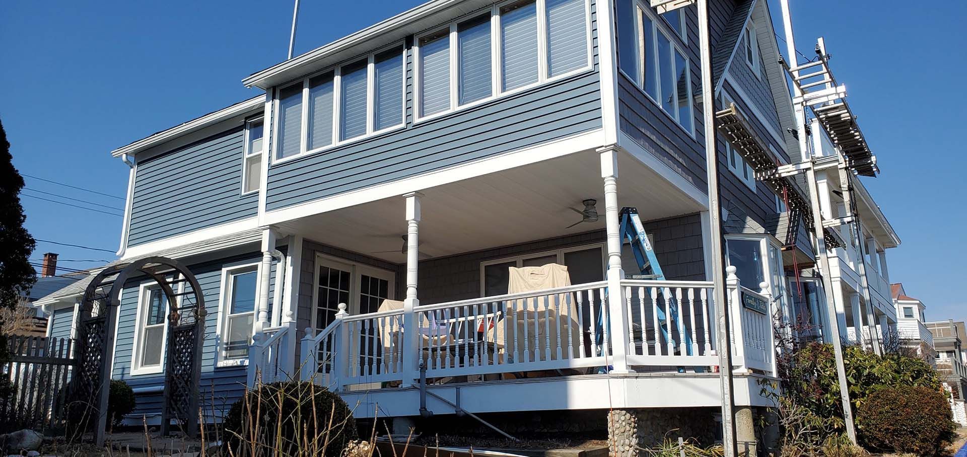 A large house with a large porch and stairs
