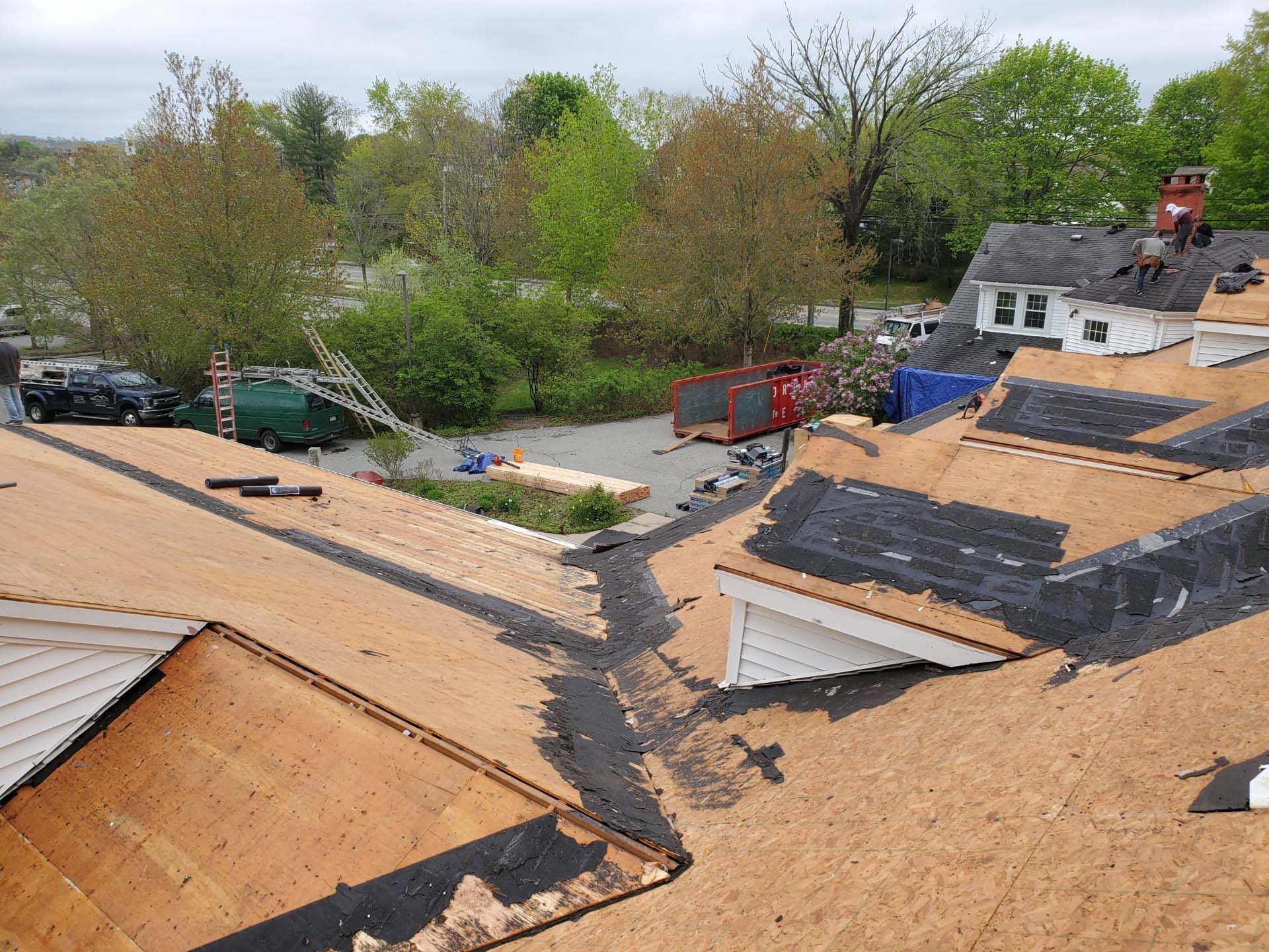An aerial view of a roof that is being repaired
