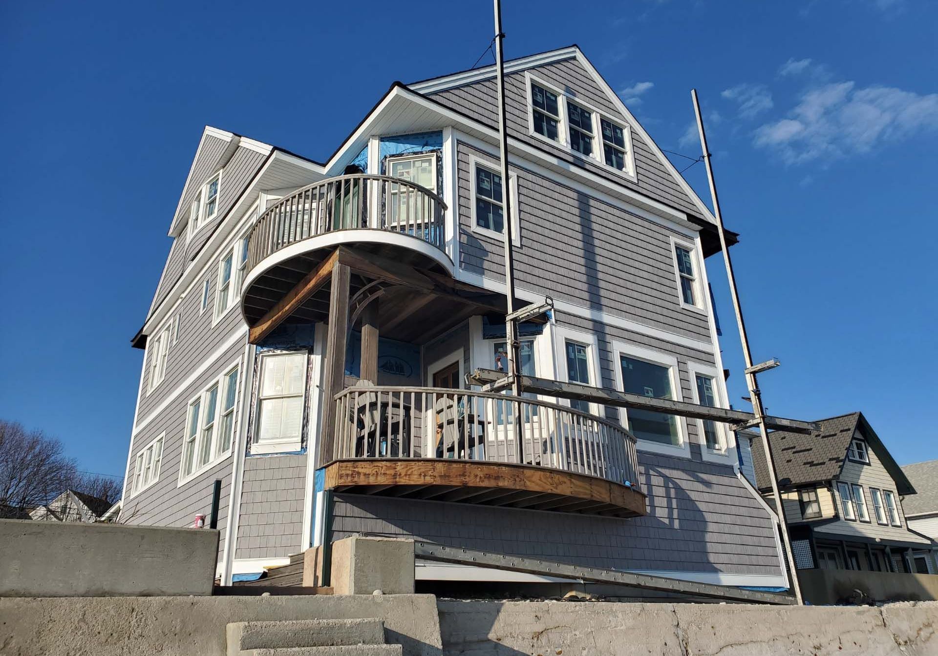 A large house with a balcony on the side of it
