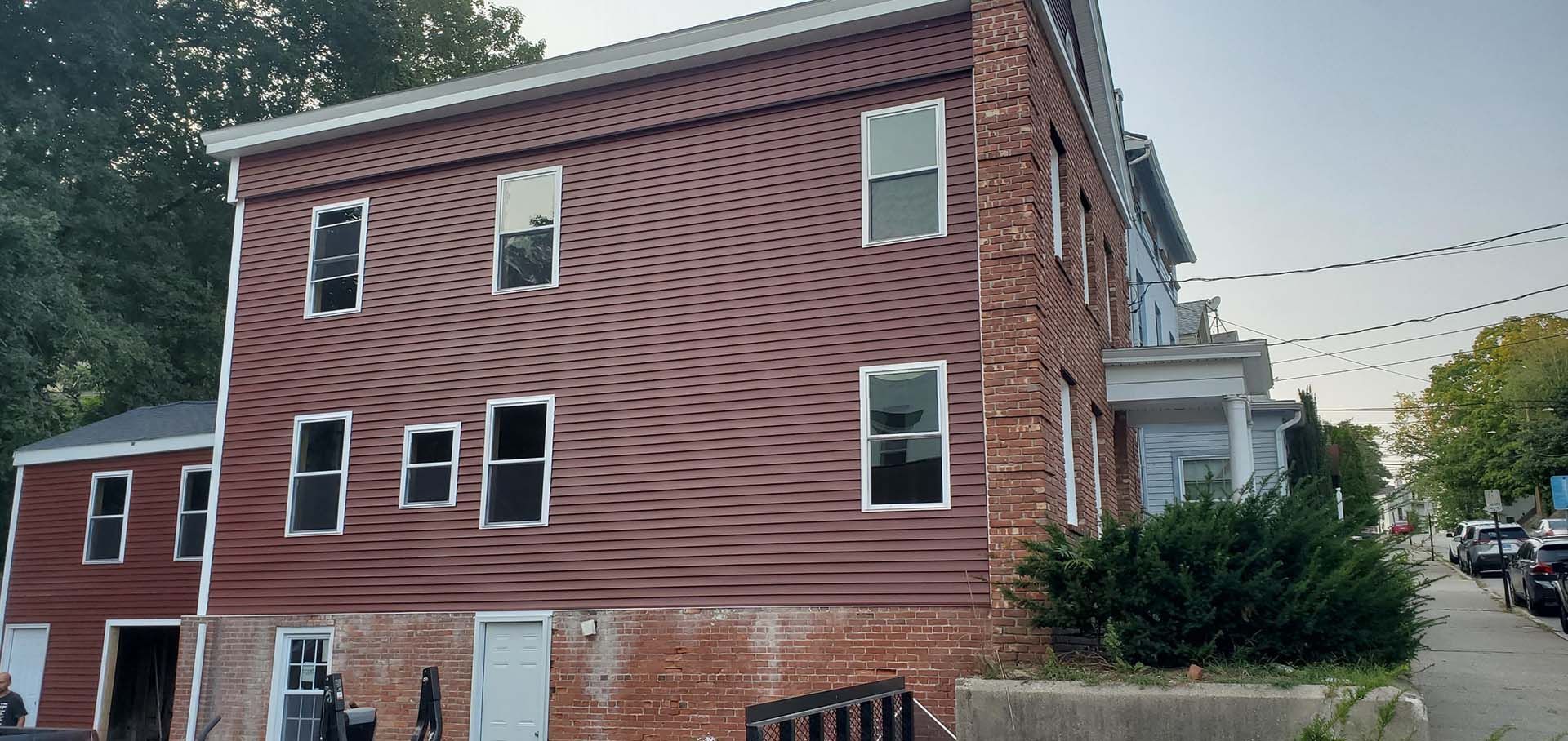 A large red brick building with a lot of windows