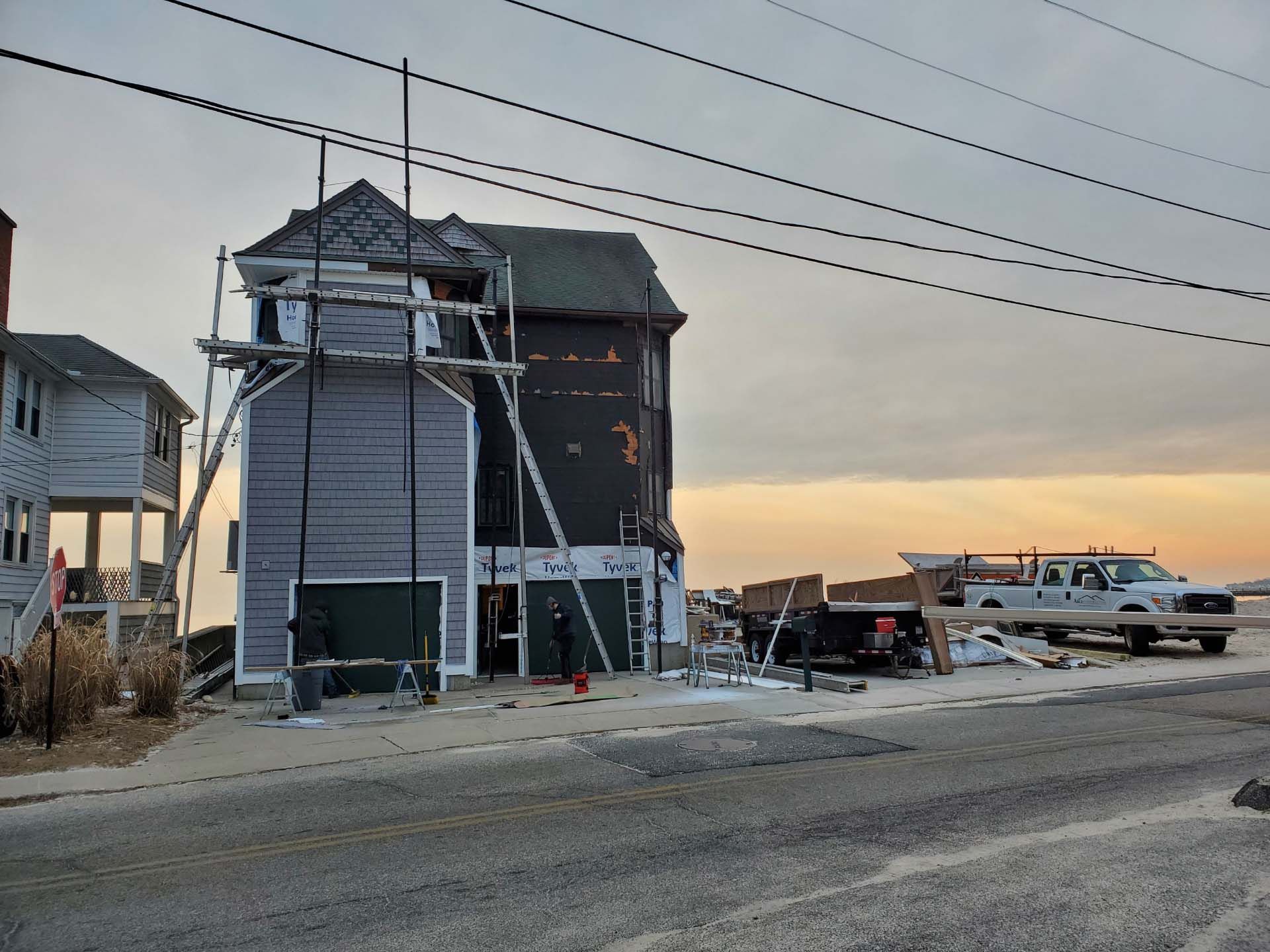 A house is being remodeled on the side of the road.