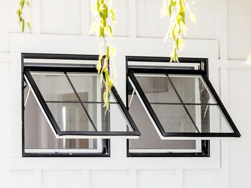 Two windows are open on a white wall.