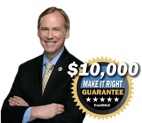 Man in suit with crossed arms, smiling, next to 