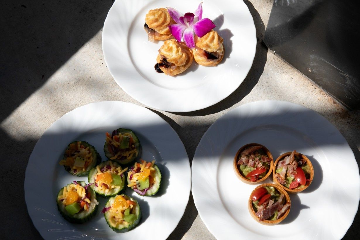Three white plates with different types of food on them