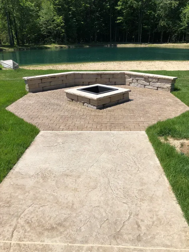 There is a fire pit in the middle of the patio.