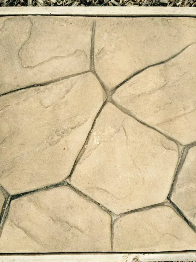 A close up of a stone floor with a geometric pattern