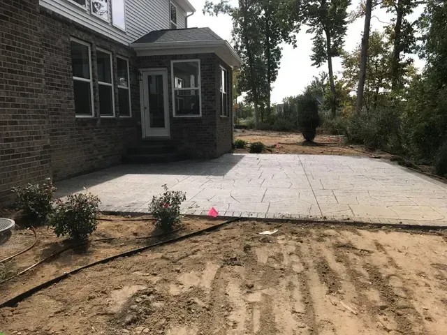 A brick house with a patio in front of it