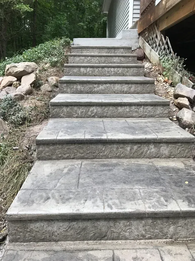A set of stairs leading up to a house.