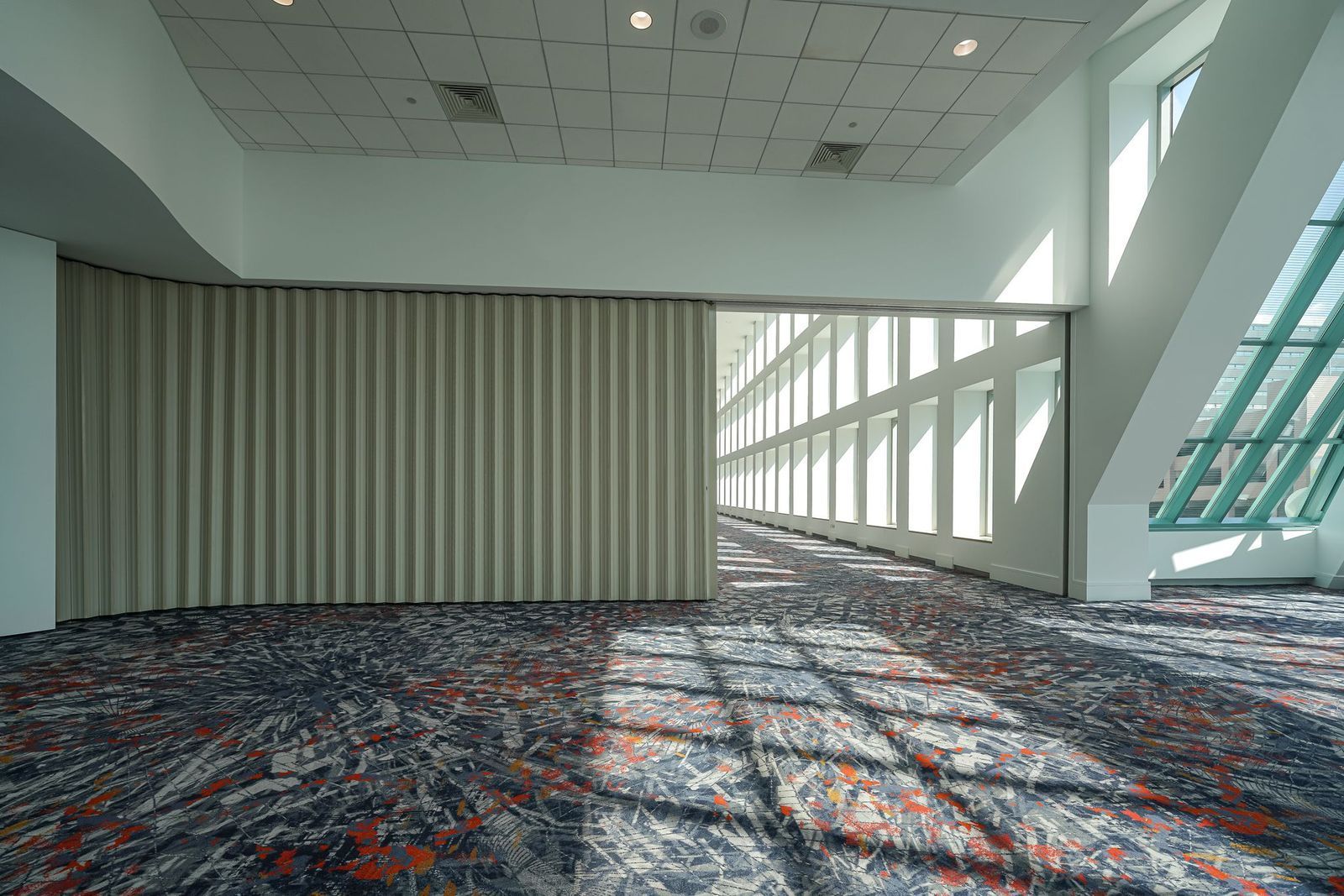 Hallway with accordion doors to divide rooms